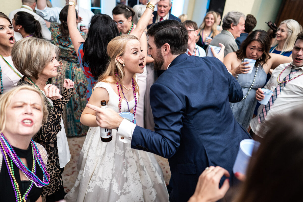 Bride and groom having fun at reception