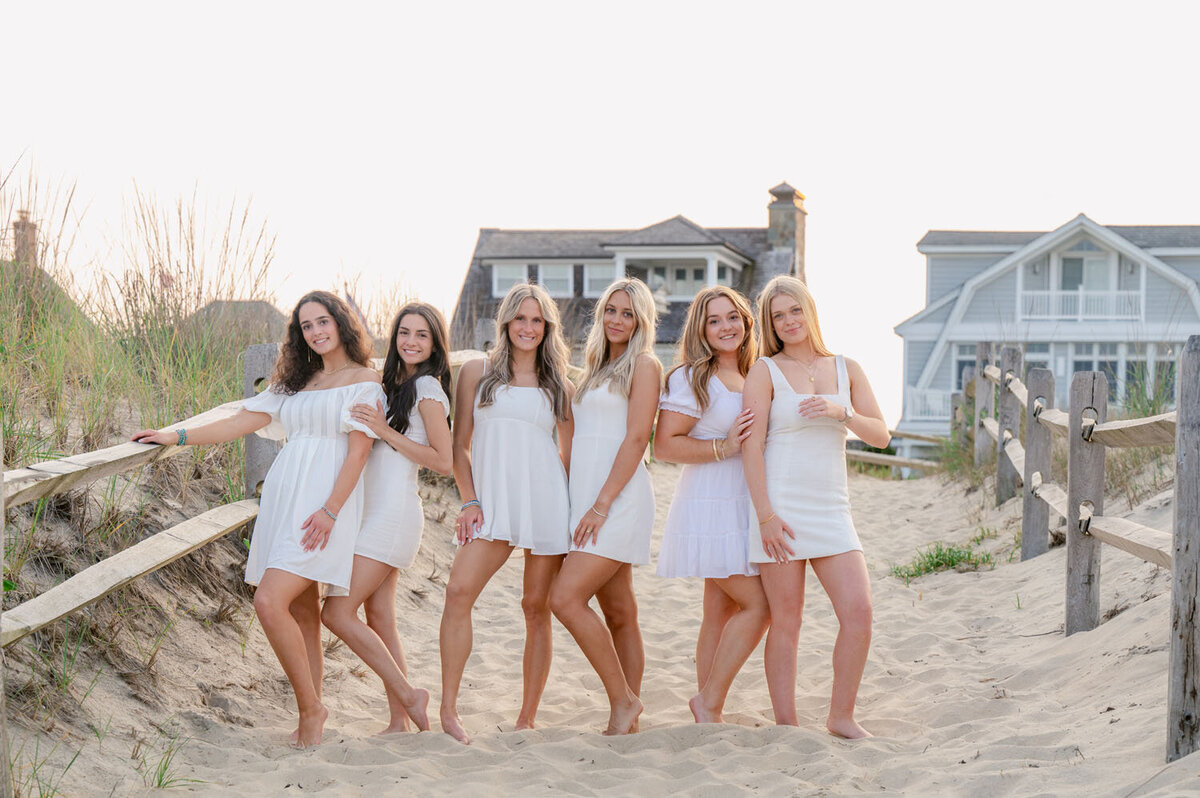 NJ senior photoshoot fun friends shoot cap and gown spring lak sea girt beach shoot white dresses-374