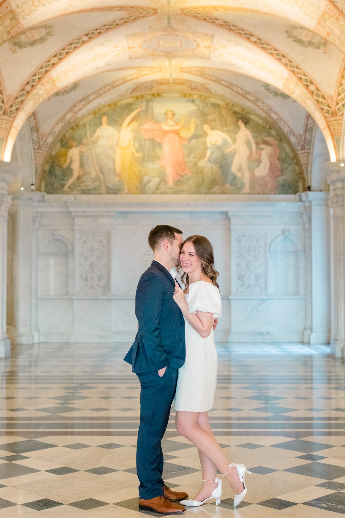 Couple taking engagement portraits at the Library of Congress in Washington, D.C. Taken by Charlottesville Wedding Photographer Bethany Aubre Photography.