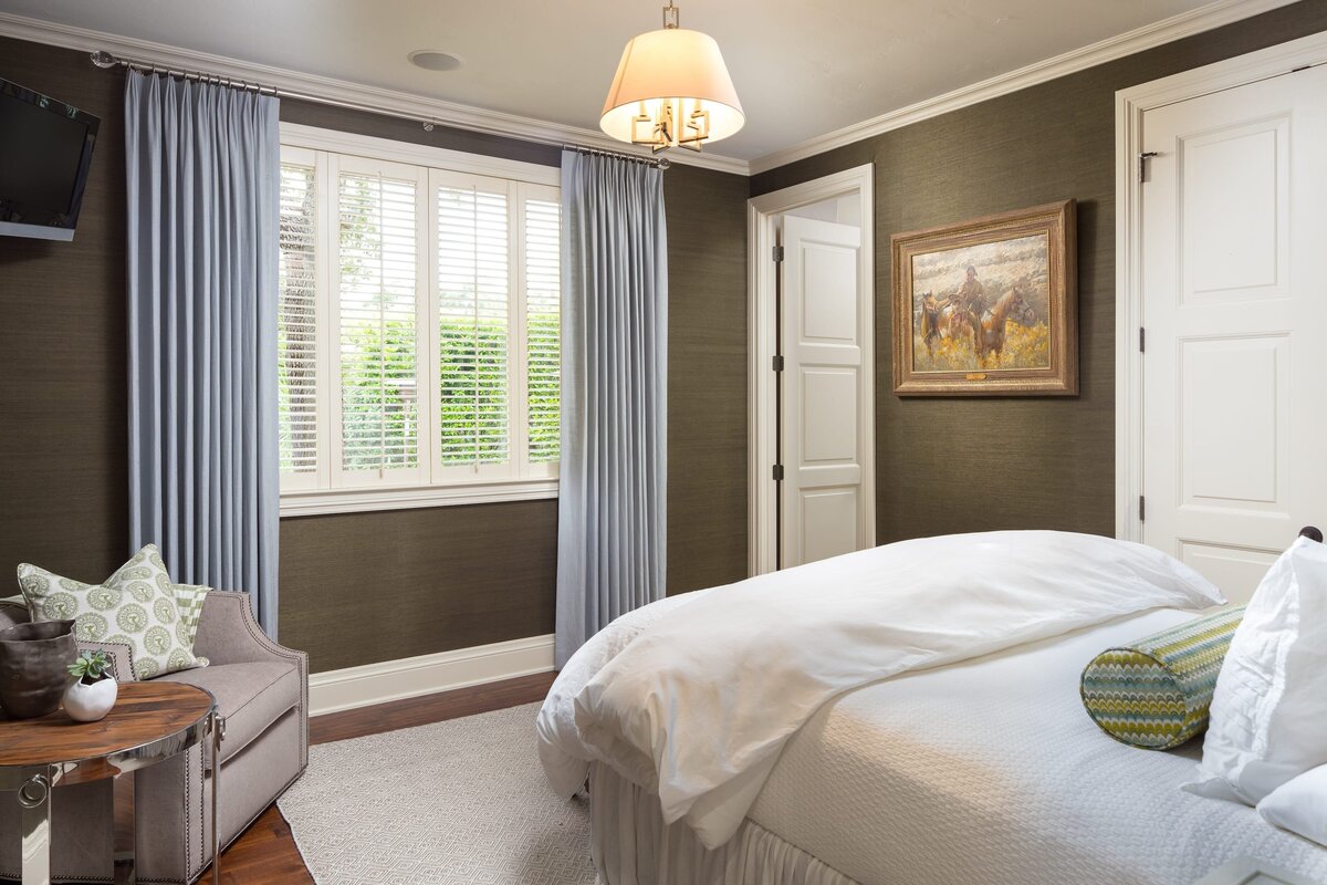 the keeping room interiors grandview bedroom with blue curtains and dark color wallpaper
