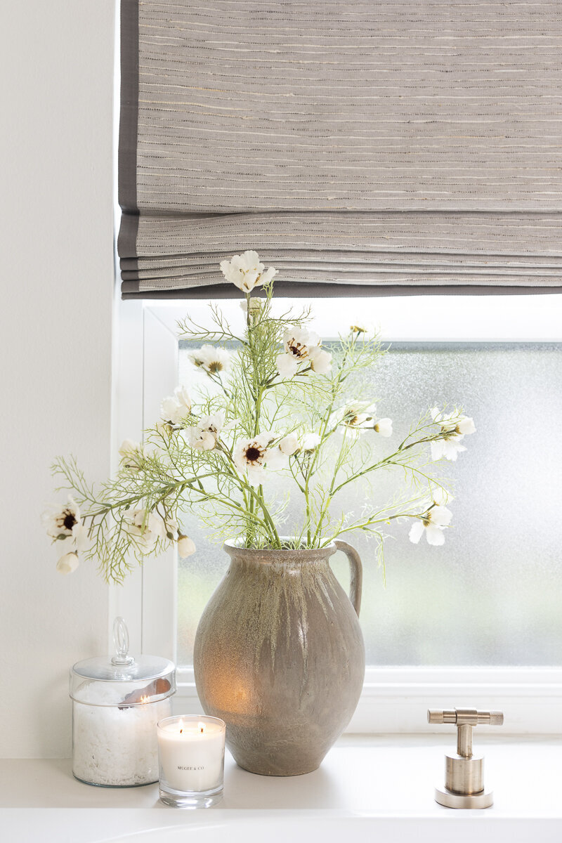 dewine design orlando interior designer belle isle bathroom with vase with flowers by window