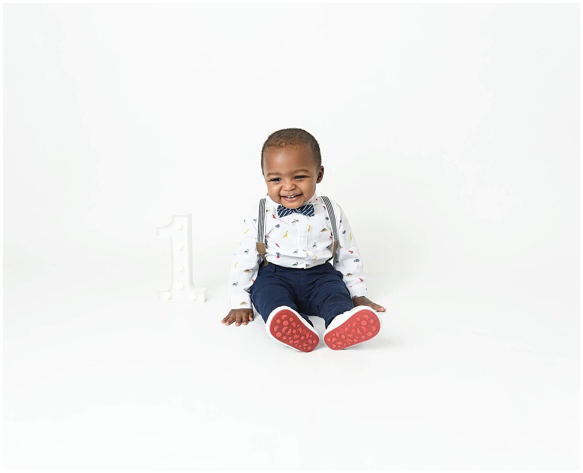 A heartwarming studio session showcasing the pure joy and innocence of a toddler.