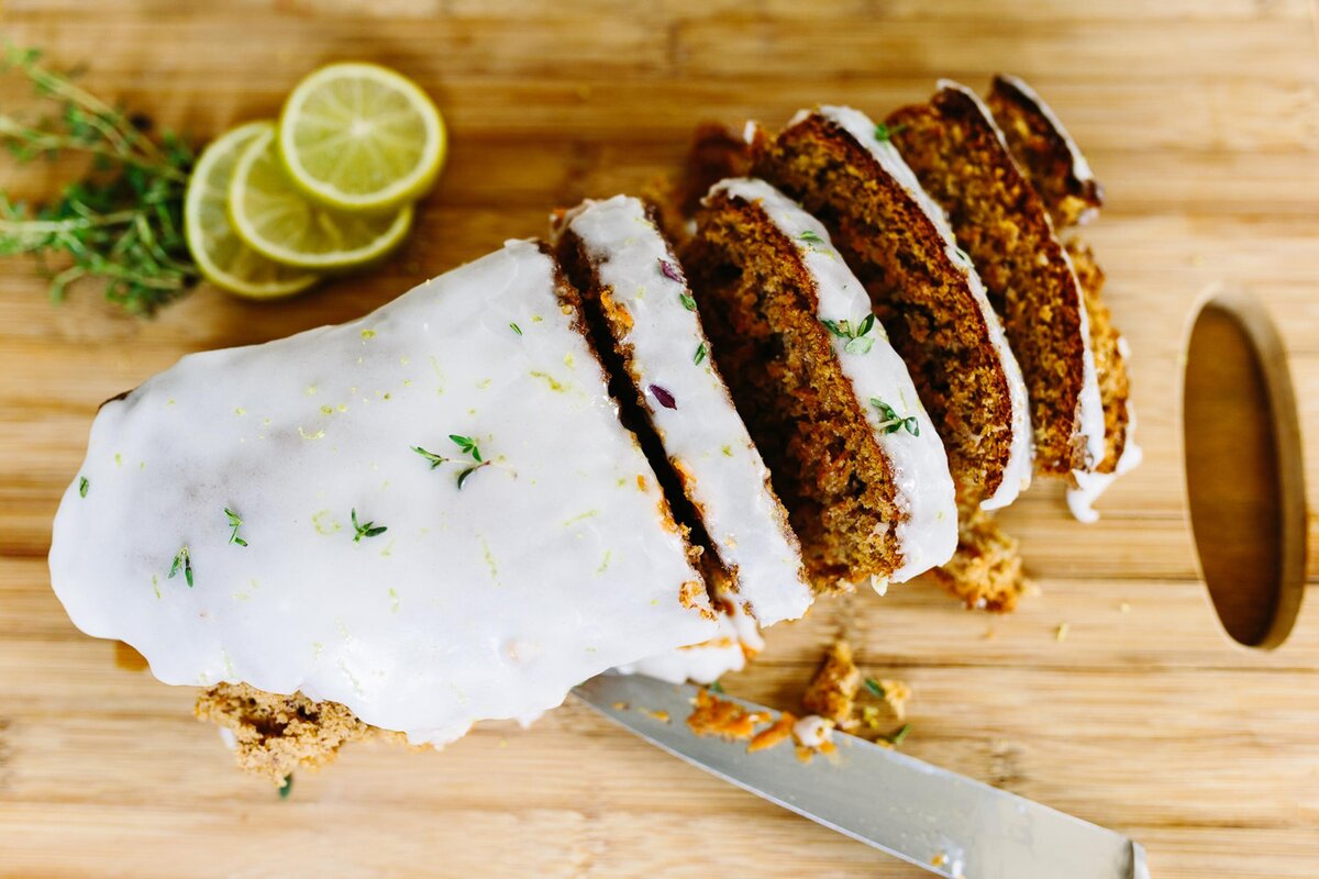 food photography overhead image of carrot cake with icing on cutting board