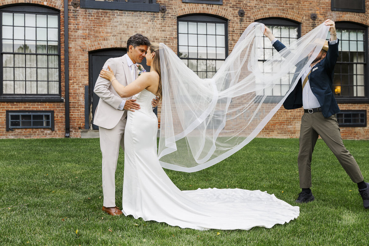 Megan and Kenneth behind the scenes at a wedding