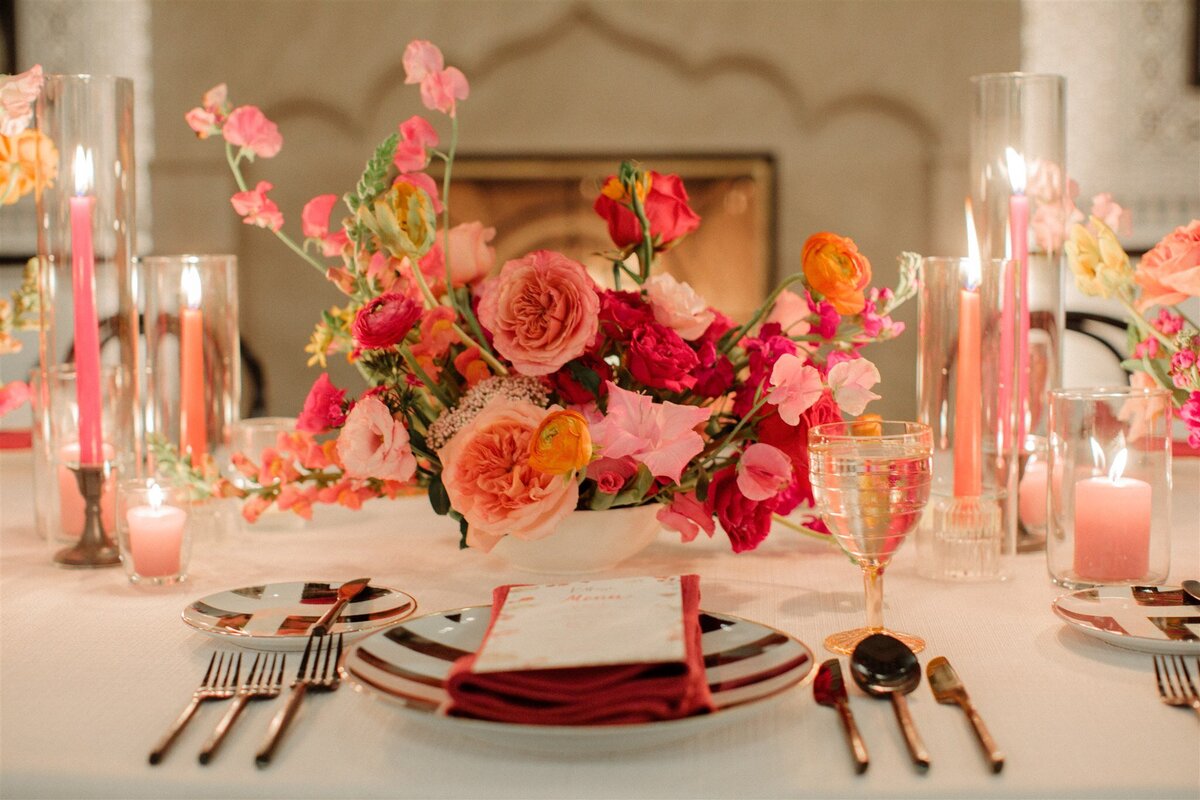 red and pink florals,  pink candles table arrangement