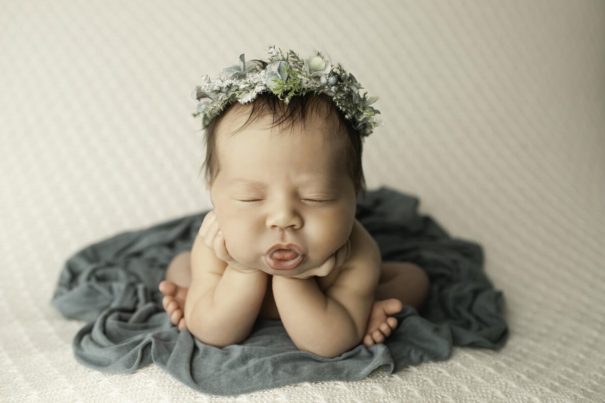 Newborn boy smiling