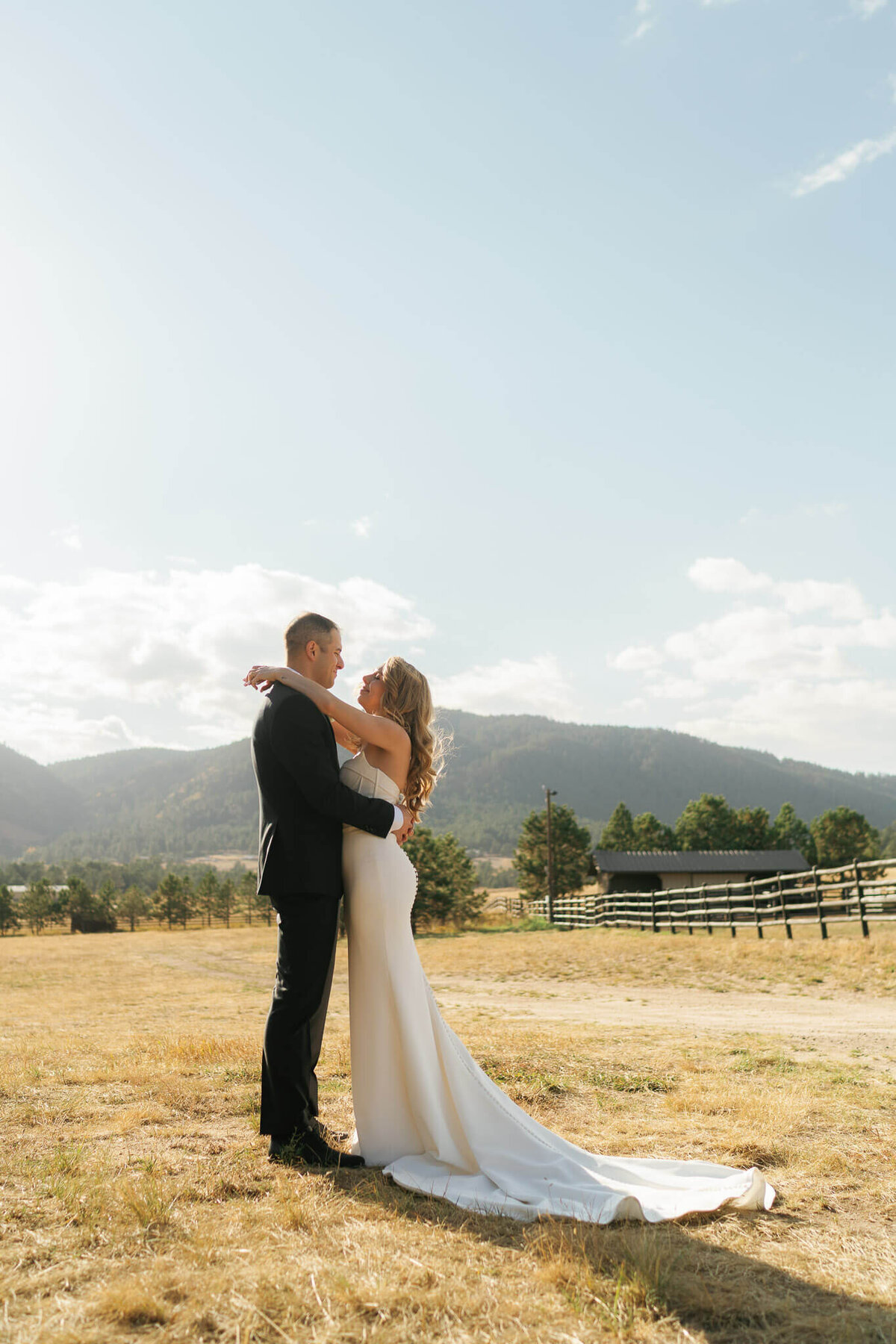 couple at a ranch in the mountains