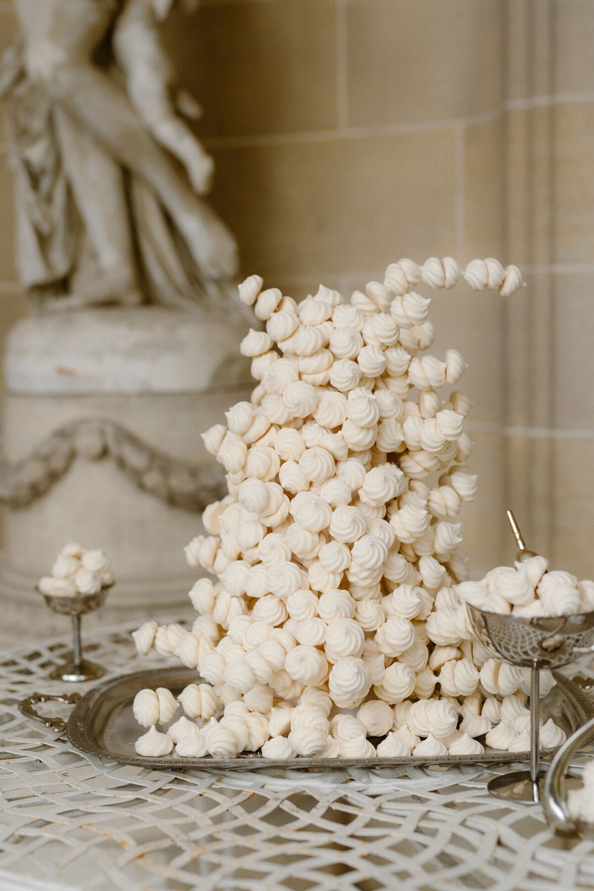 Alternative wedding cake tower made of meringue, styled at a French château wedding.