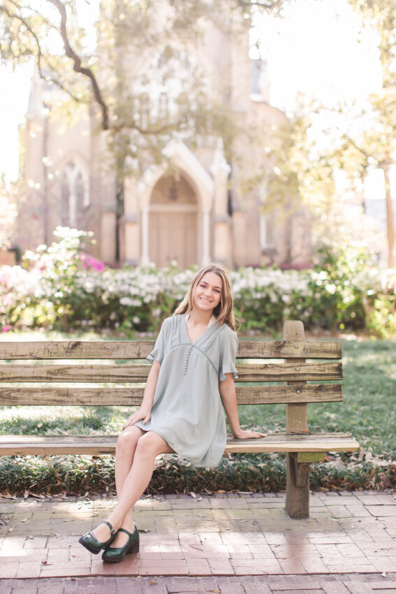 senior girl sitting on bench