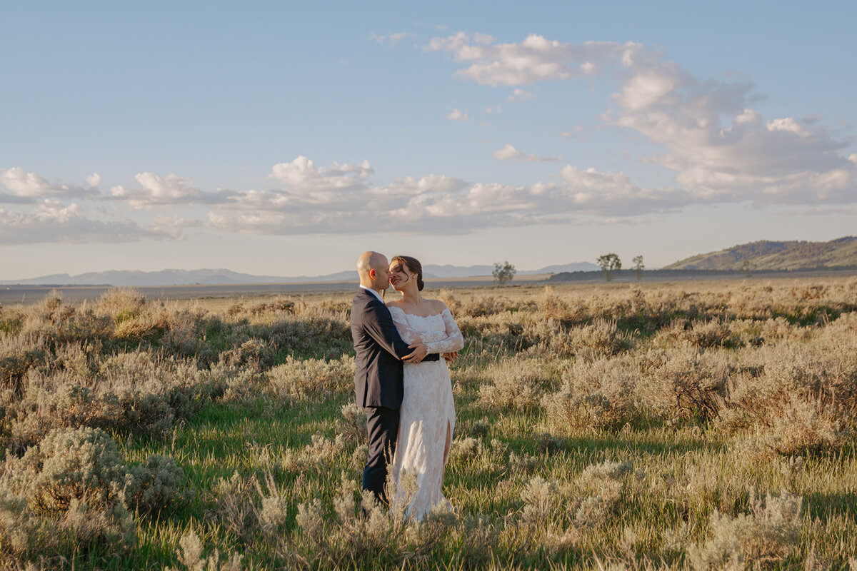 Amangani elopement with couple taking sunset photos after wedding ceremony in Jackson Hole, Wyoming