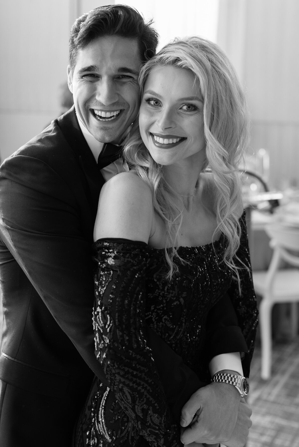 A gorgeous couple in black and white photographed when they were guests at a wedding at the Four Seasons Toronto