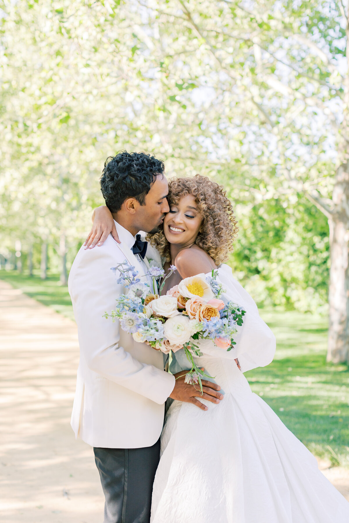 joyful-bride-groom-intimate-outdoor-wedding-portrait-floral-bouquet