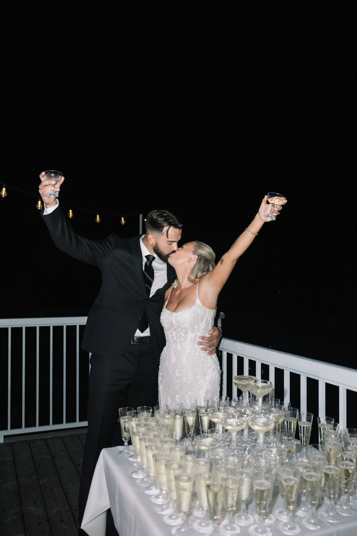 couple-kissing-celebrating-during-reception-nika-helgeson-photography