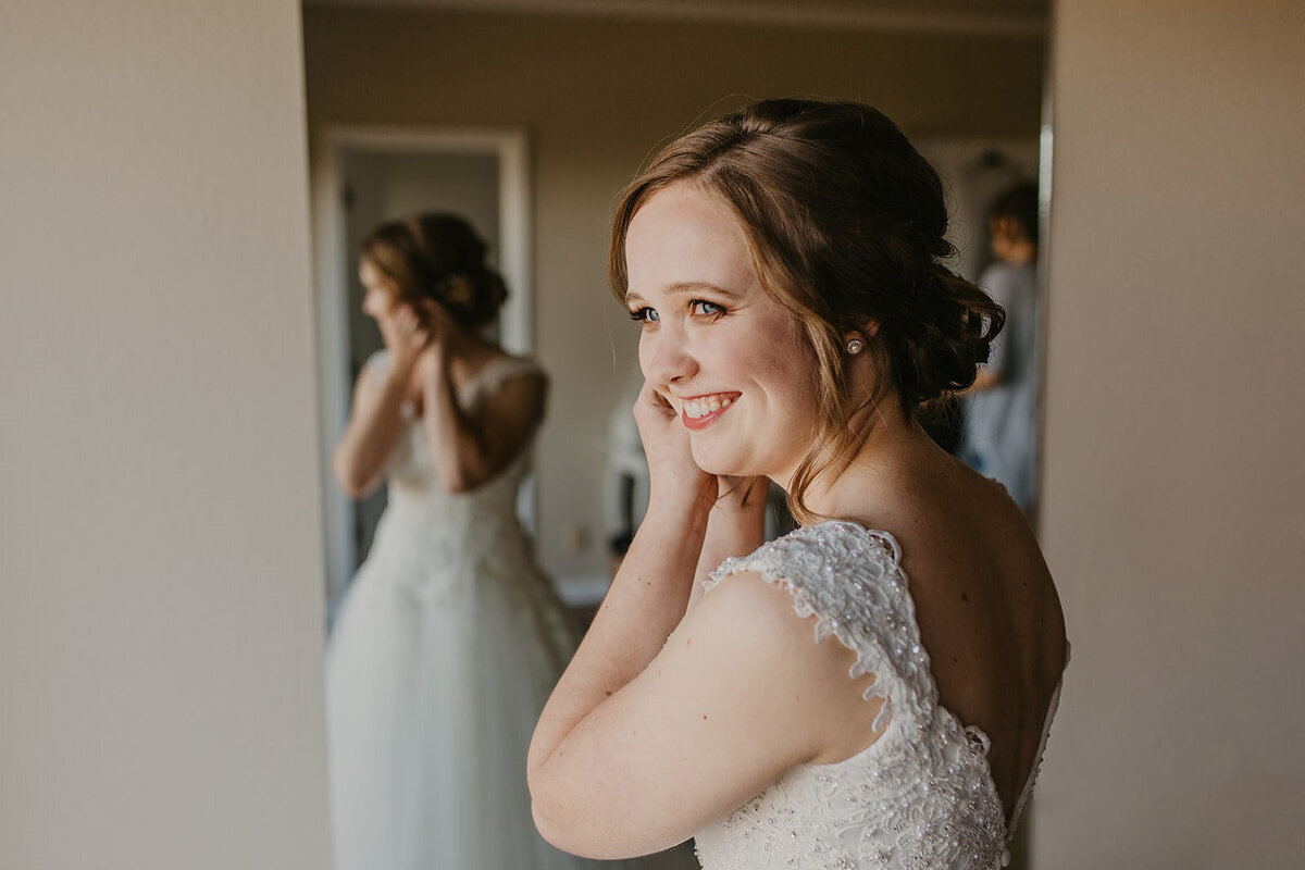 Blue eye bride with soft smokey brown eye makeup and a peachy pink lip