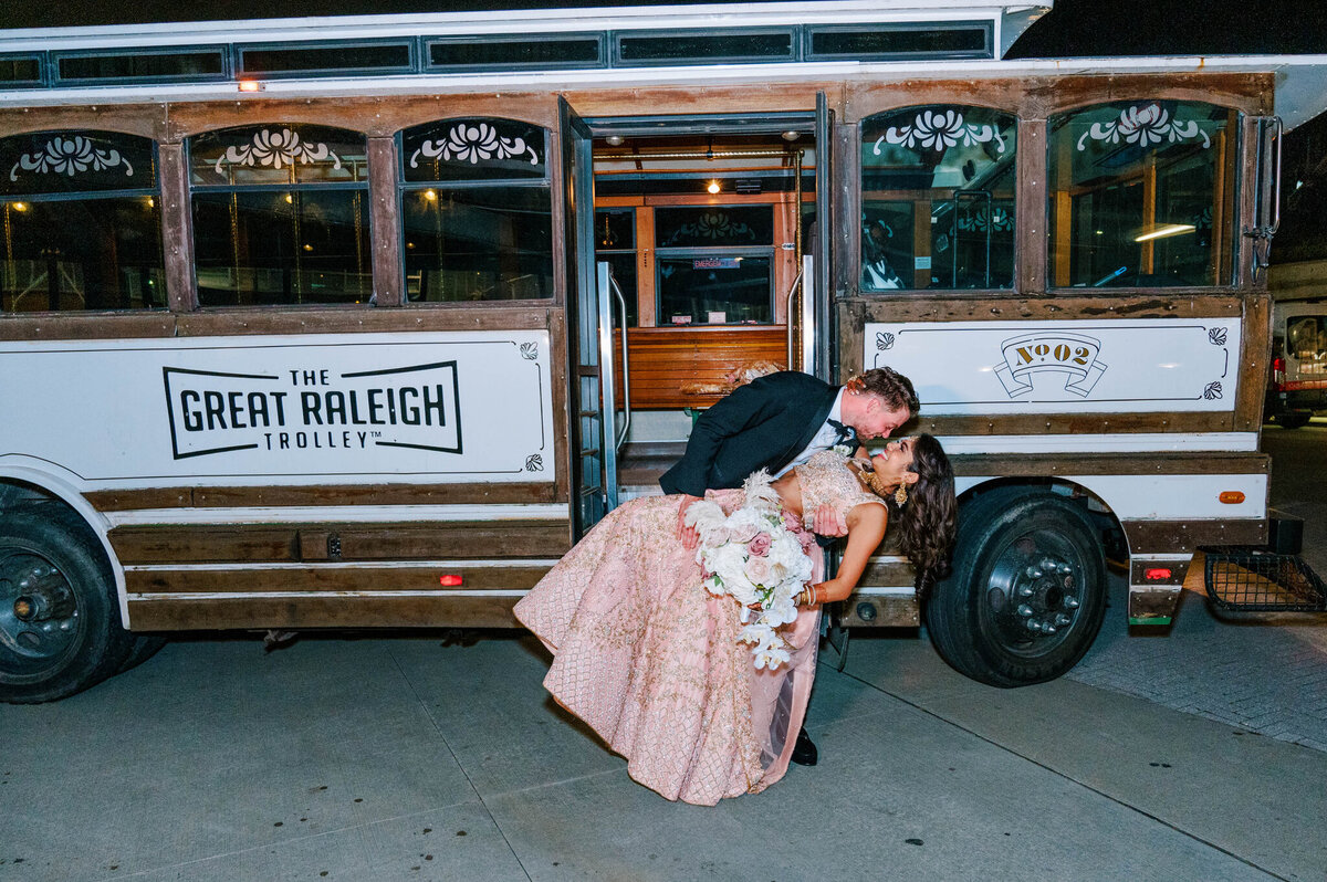 Shaoleen & Collin Reception event 7 grand exit leaving on the Great Raleigh Trolly 1