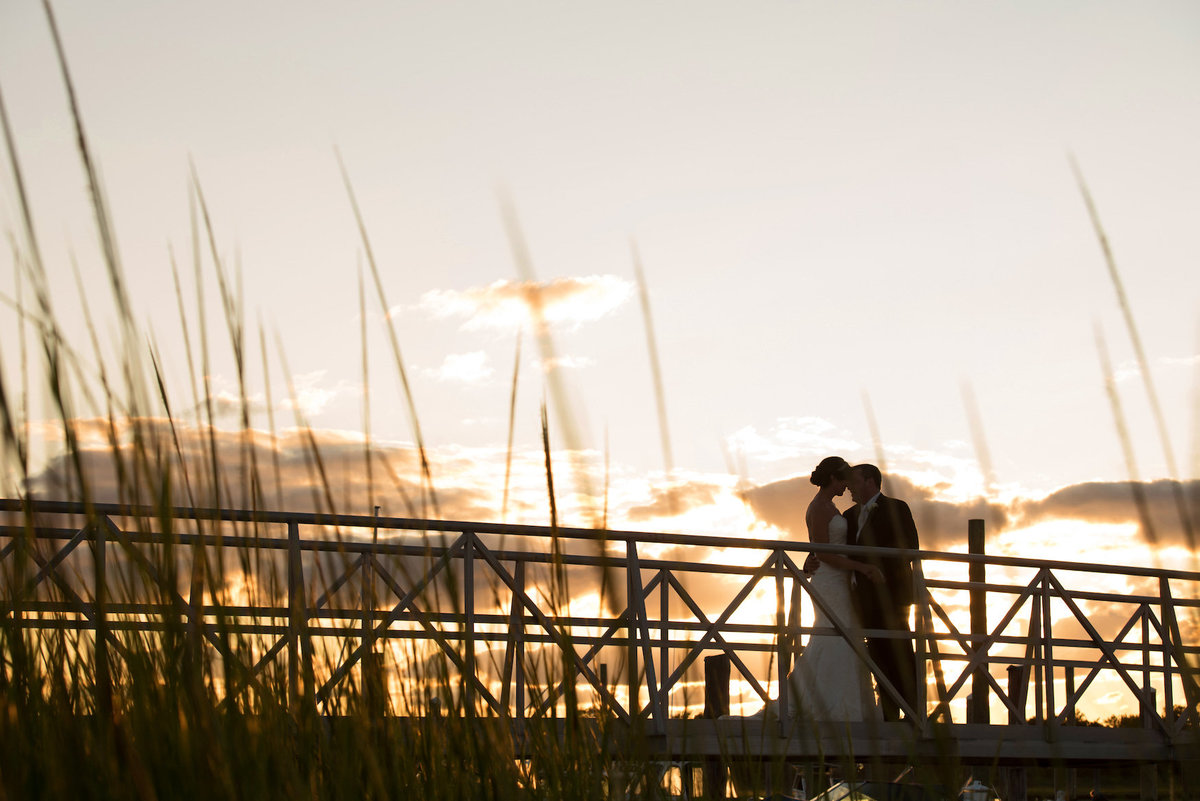 photo of bride and groom on boardwalk from wedding at Lawrence Yacht and Country Club