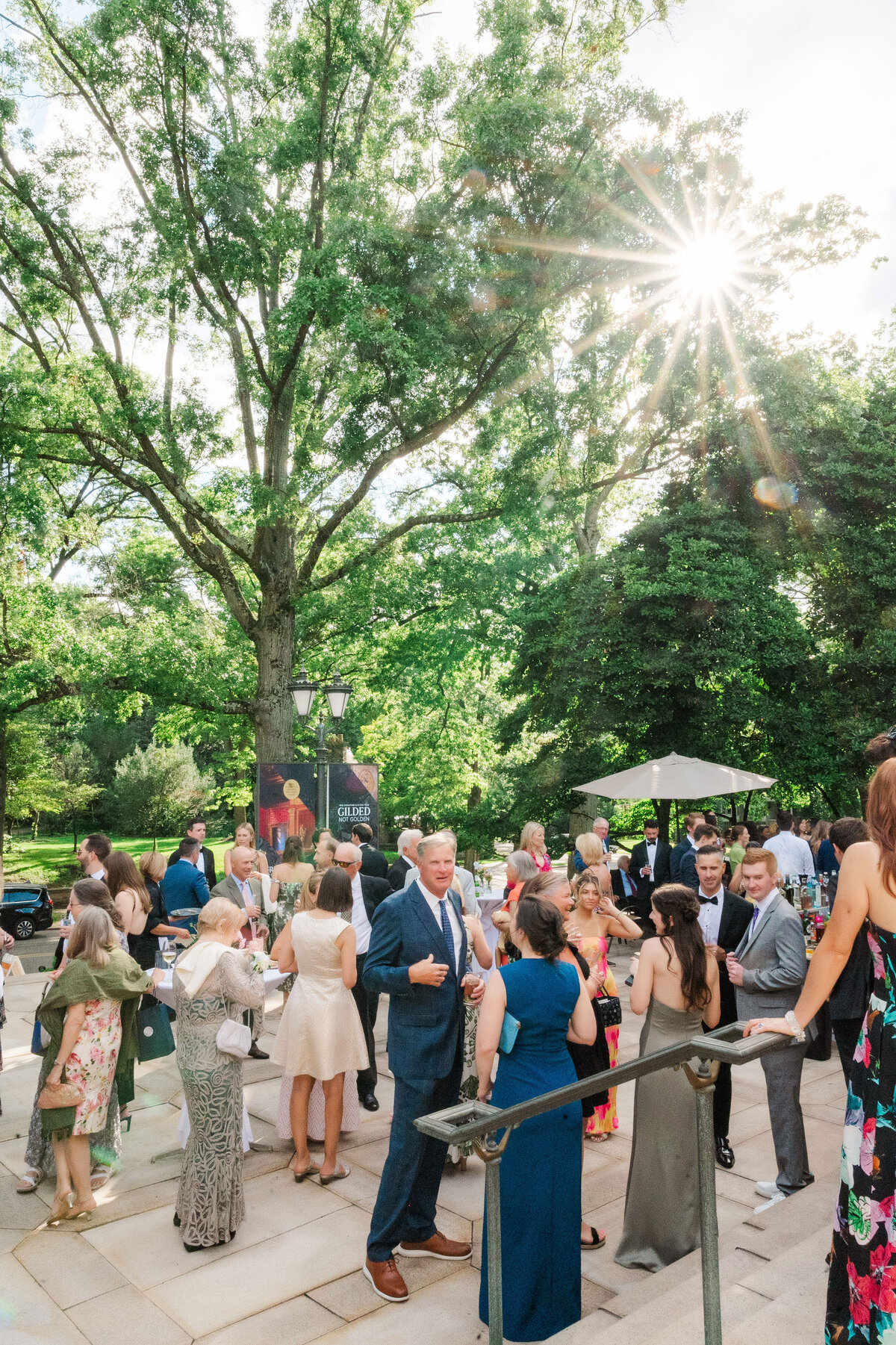 guests enjoying a cocktail hour at the front patio on Frick Museum
