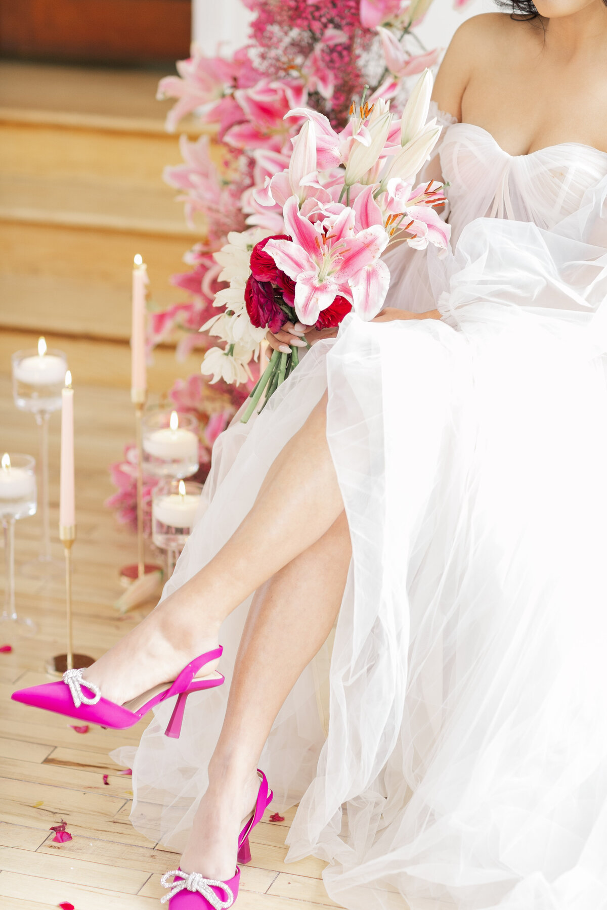 bride wearing bright pink shoes  holding pink and white lilies at hall at safe horbor