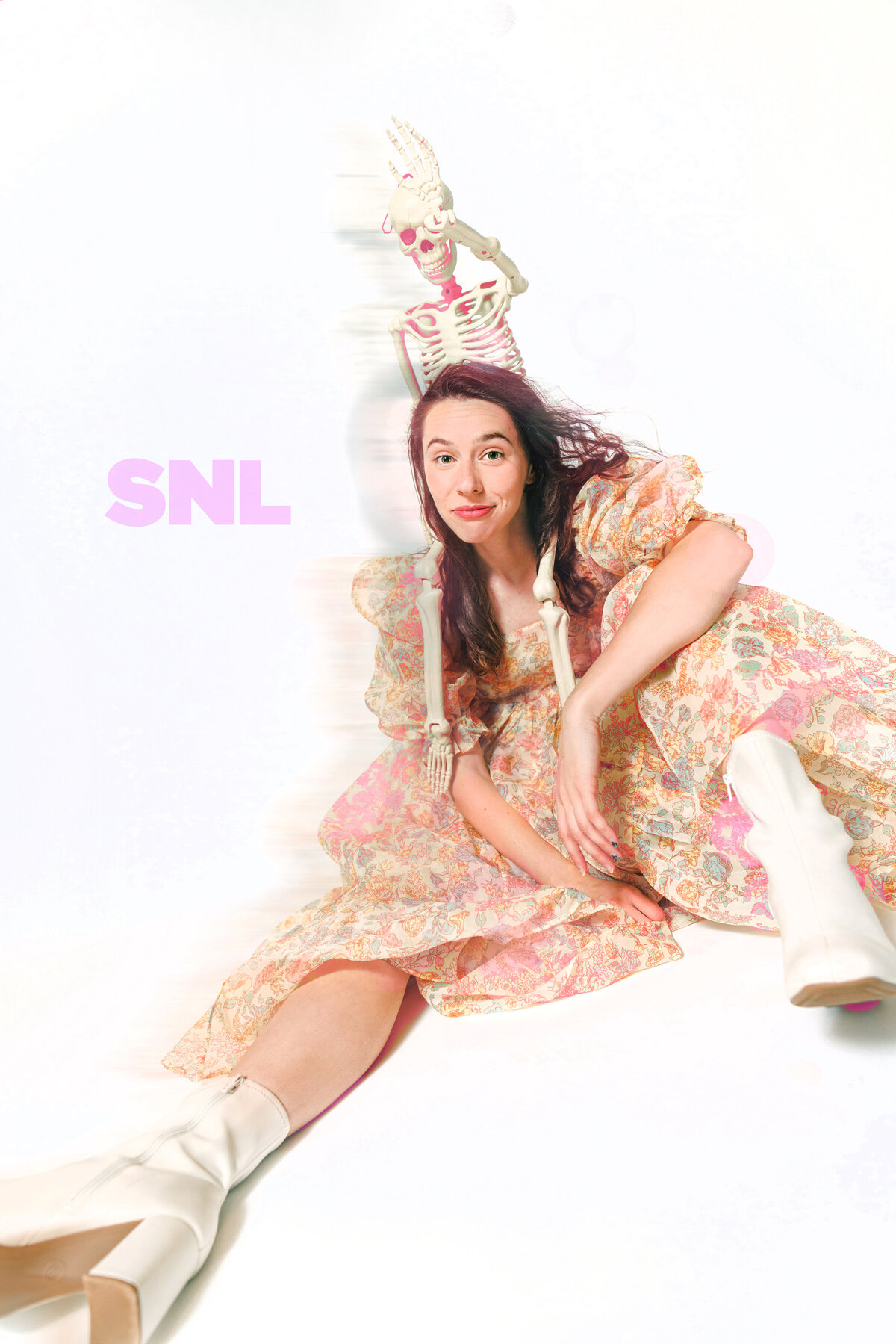  A playful, SNL-style portrait of a woman in a floral gown seated beside a pink skeleton. This editorial image blends humor and fashion for a unique branding visual. Captured by Dani Lacey in Greenville, SC