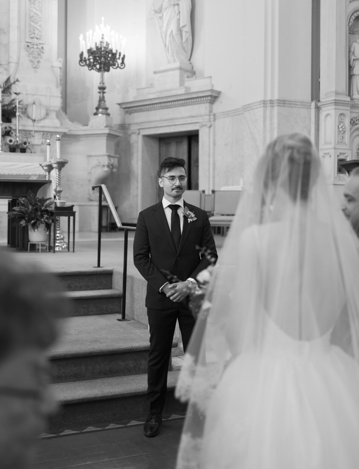 A bride arrives to her groom at the altar of St. Peter and Paul church, Detroit wedding venue