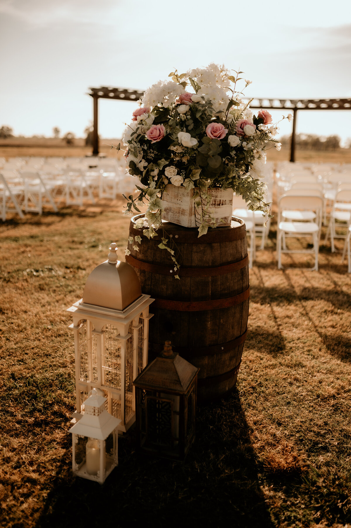 wedding decor for outdoor fall wedding with florals, lanterns and candles