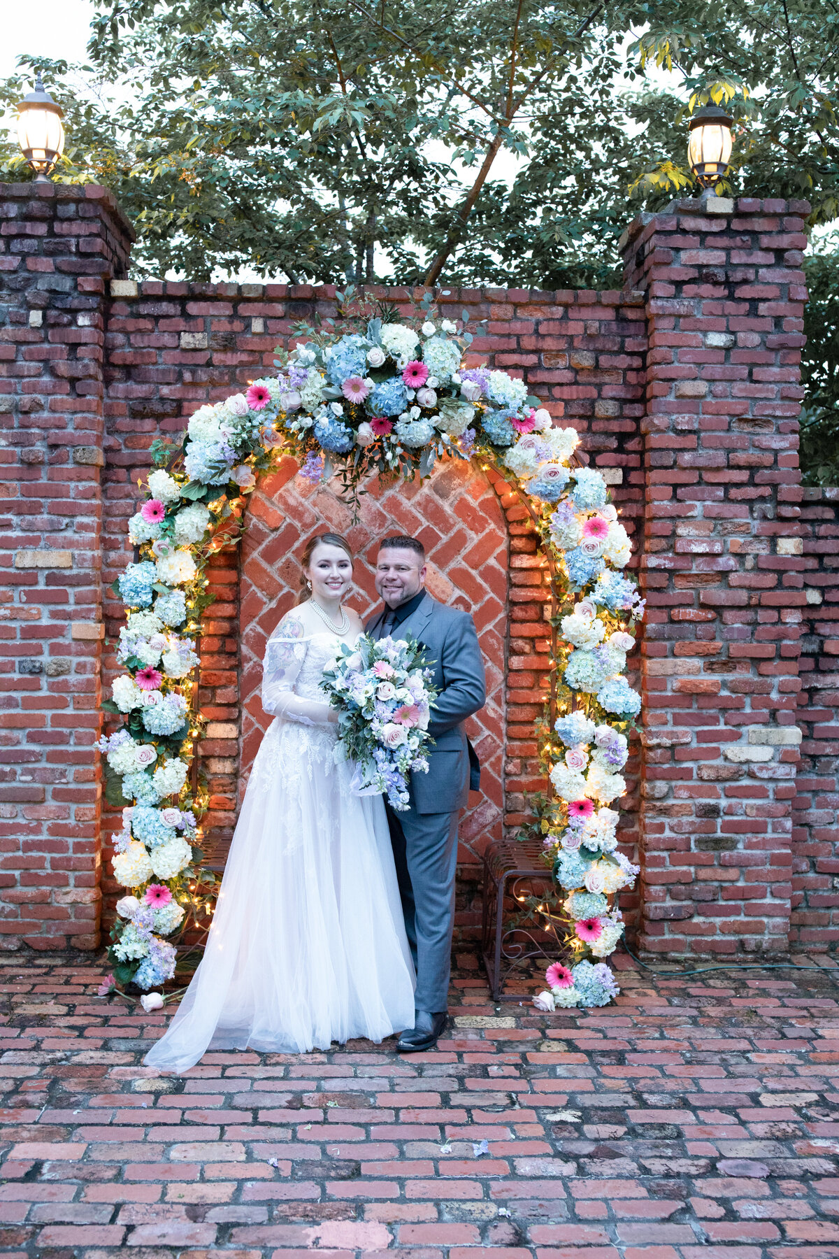 Carl-House-Wedding-Bride-and-Groom-Flower-Arch-Portrait