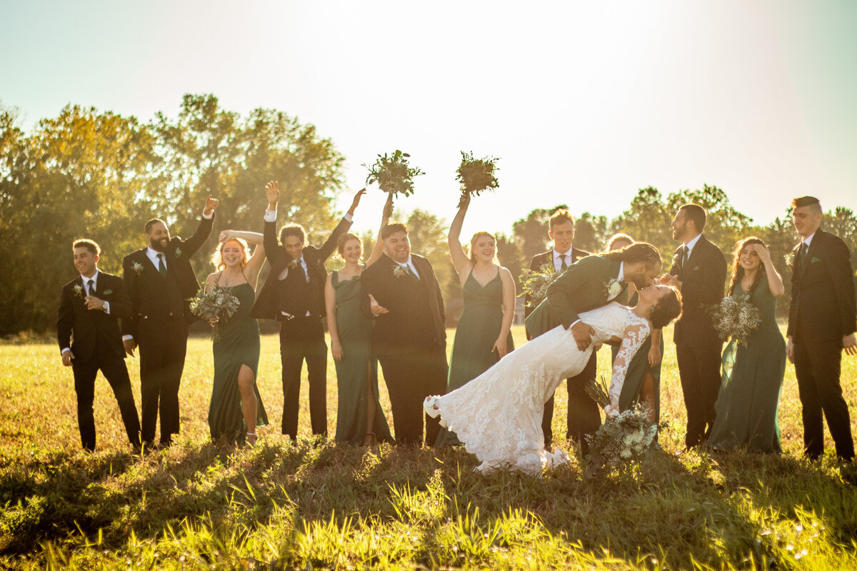 Bride and groom wedding photo shot in a field in Saginaw Michigan. Photo by Devin Ramon Photography.