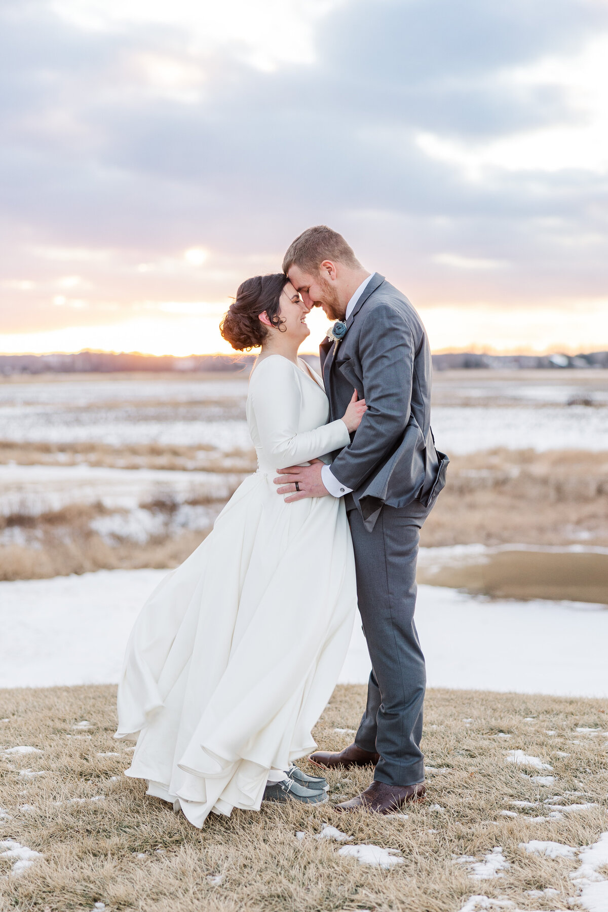 a Wisconsin couple embracing at sunset on their wedding day