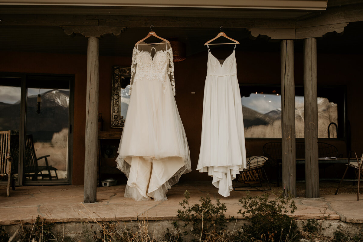 two bridal gown hanging outside