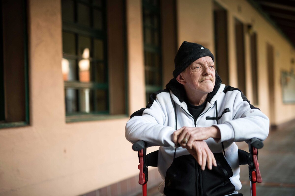 A dignifying shot of a homeless man in a wheelchair at Father Joes Villages in San Diego CA