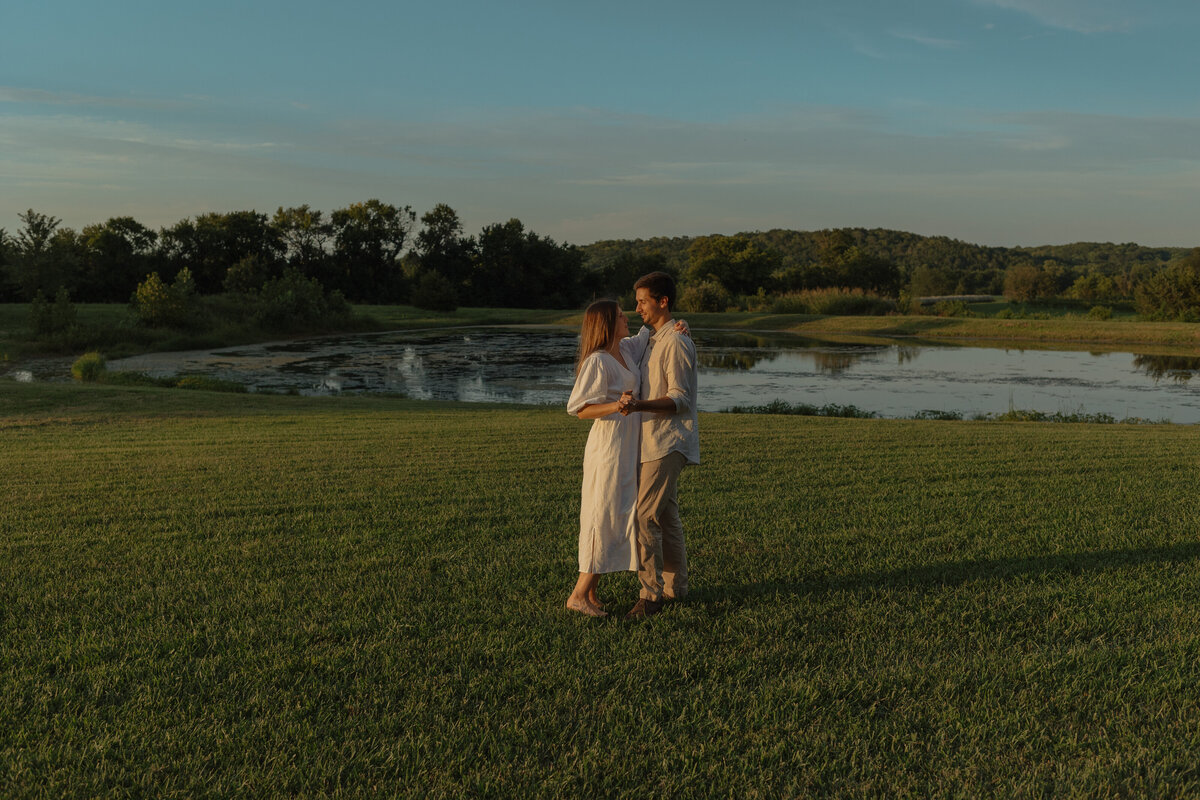 Sunlit picnic moment during a couples session in a vibrant tropical winery setting

