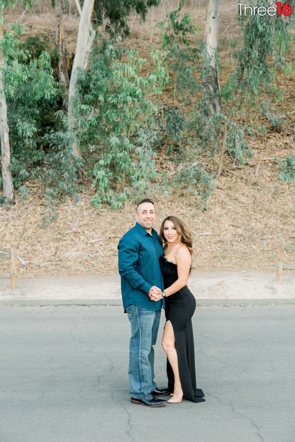 Engaged couple pose for the Orange County Engagement Photographer
