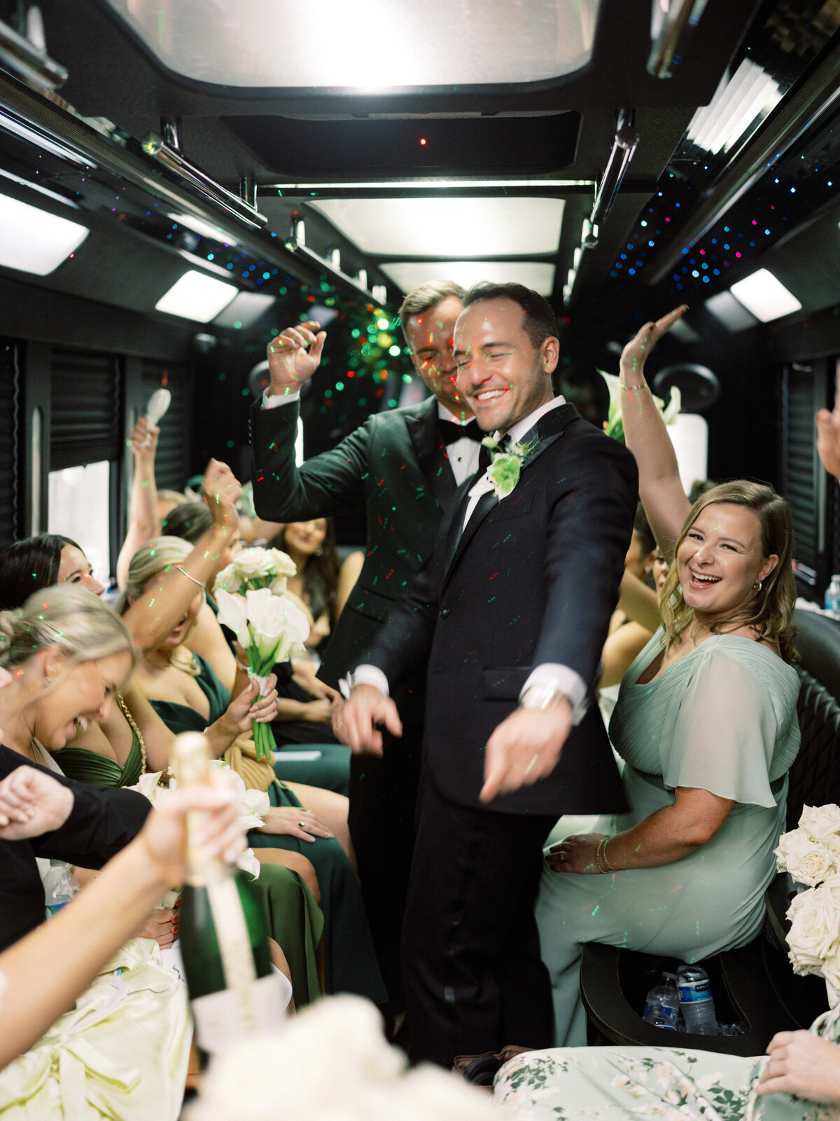 A stunning scene within a party bus, where the groom joyfully dances with friends, creating an atmosphere filled with love, laughter, celebration, and unforgettable memories.