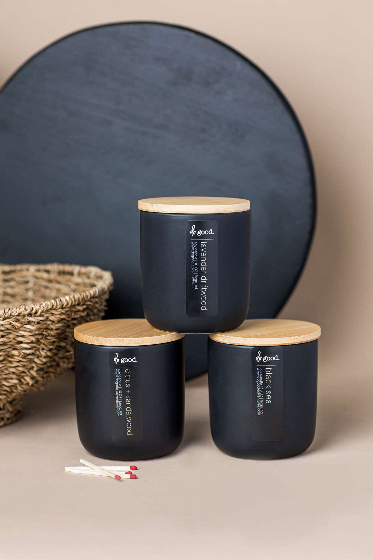 a styled photo of three black candles