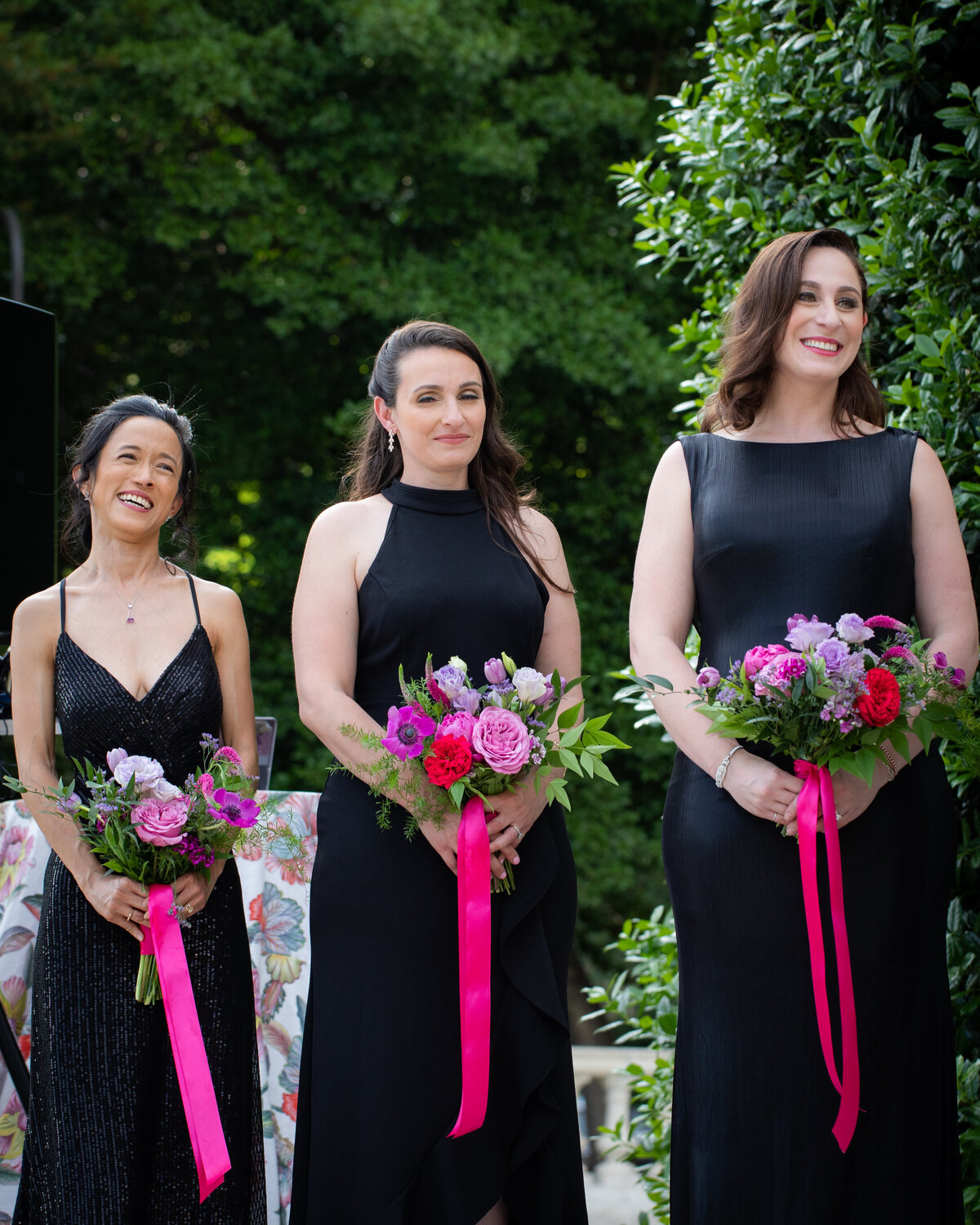 Fuschia and lavender wedding flowers with silk ribbons. Personalized floral design for weddings and special events at venues in Chestertown, MD, and Kent Island, MD.