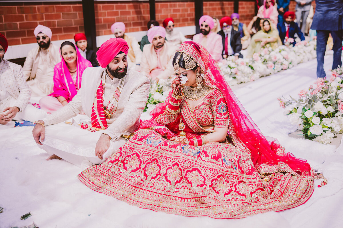 A sikh bride shedding a tear during the anand karaj ceremony during the wedding at marriott owing mills in md