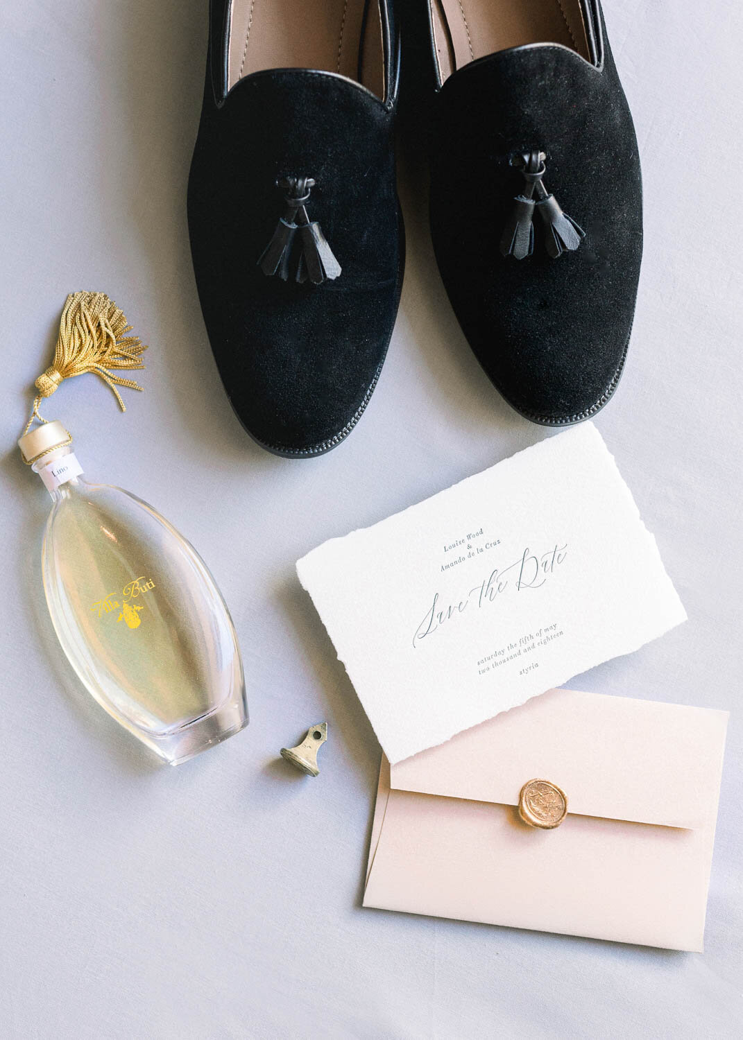 groom's details such as shoes and parfum