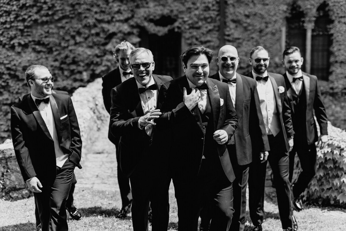 Groom and groomsmen walking in Castle