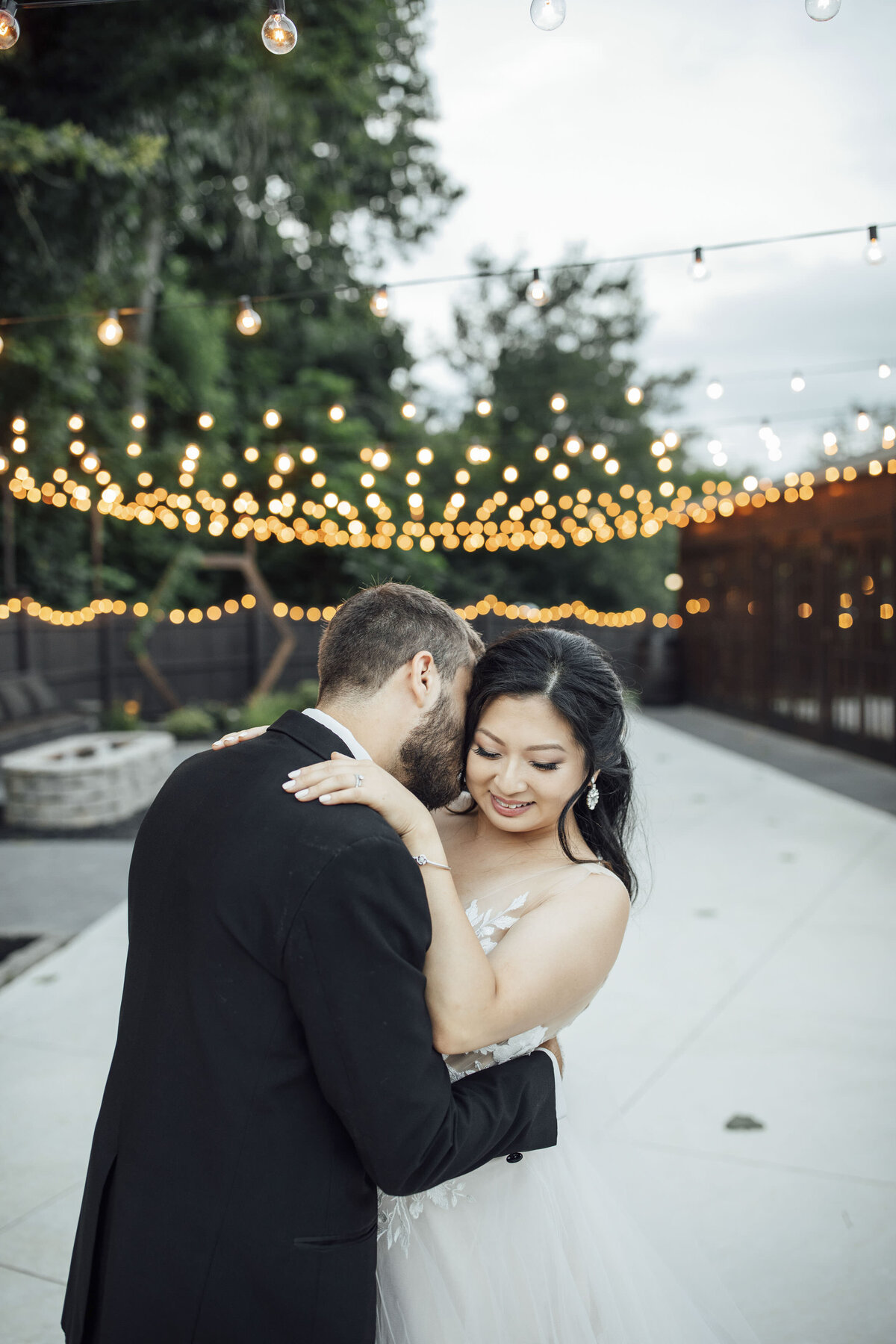 hamilton-manor-summer-wedding-photo-bride-groom-laughing-patio-twinkle-lights-hamilton-township-new-jersey