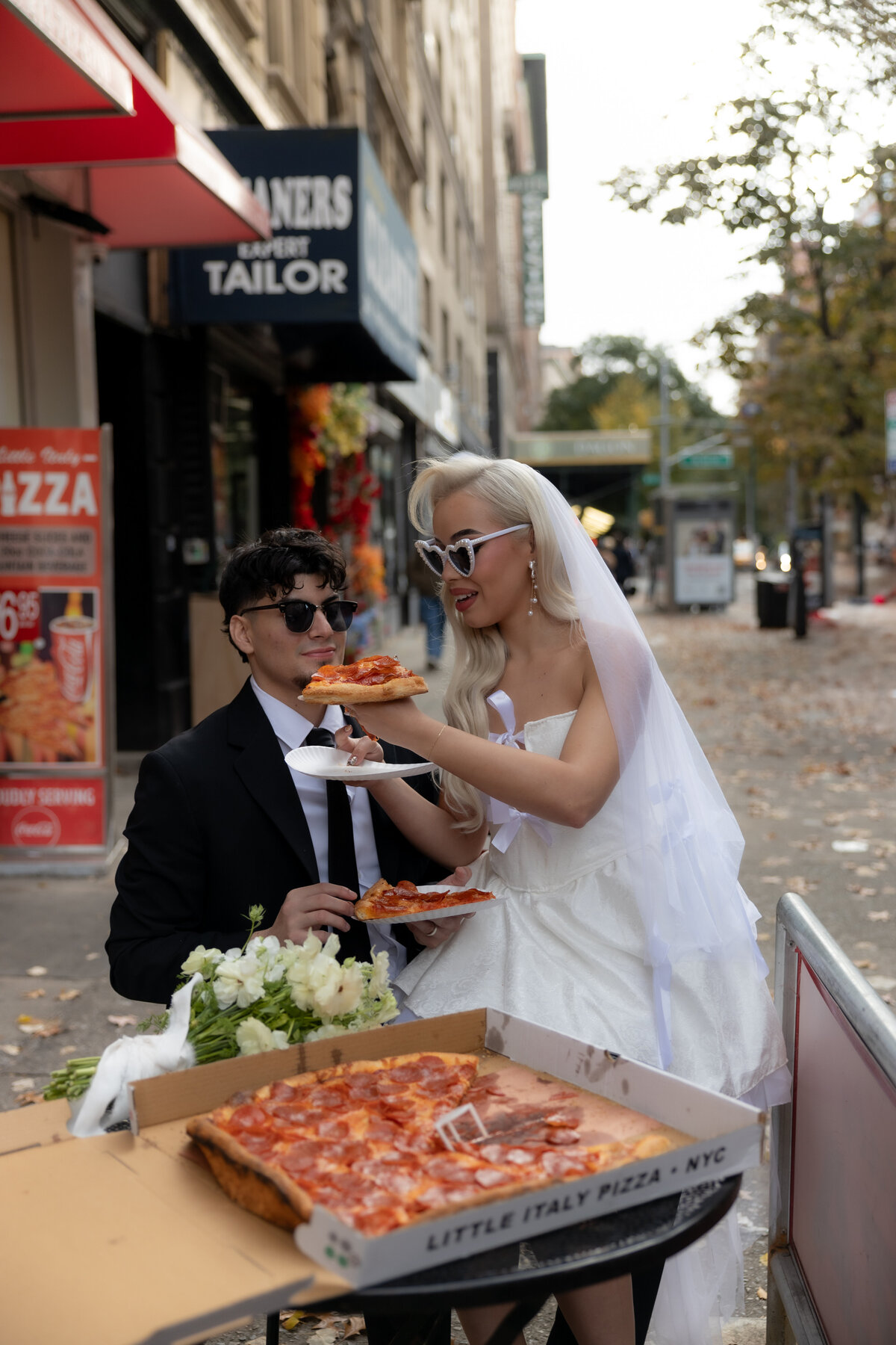 Close-up of a pizza slice with melted cheese during the couple’s NYC elopement pizza celebration.