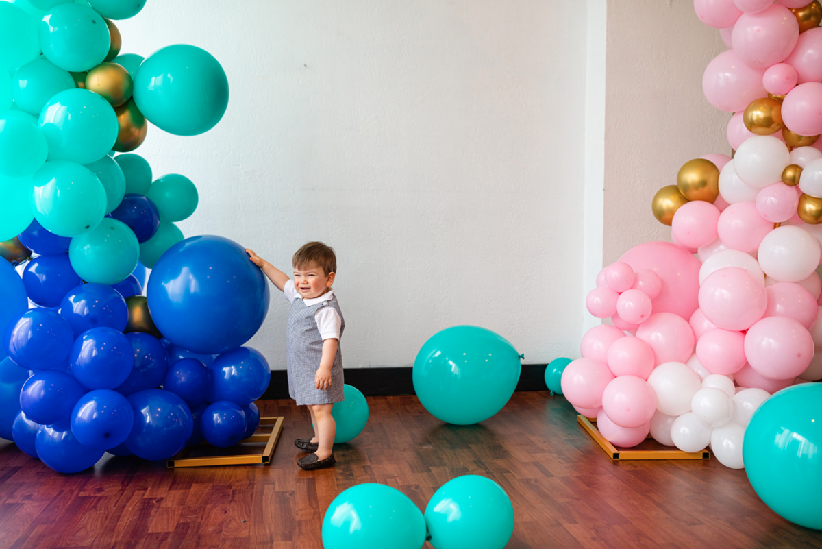 pink gold white and blue balloon arch
