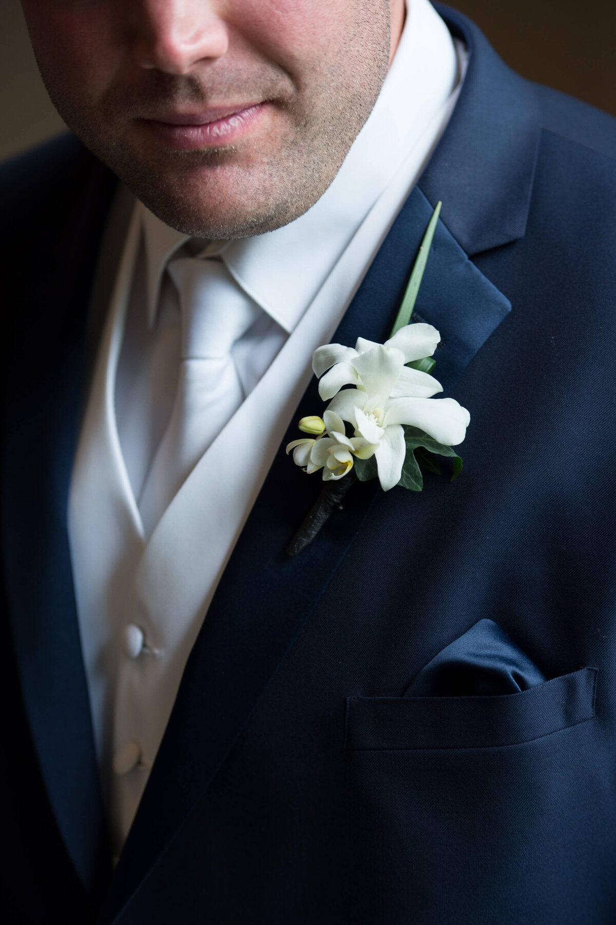 photo of groom's boutonniere during his Ottawa wedding at Ottawa wedding venue The Brookstreet Hotel