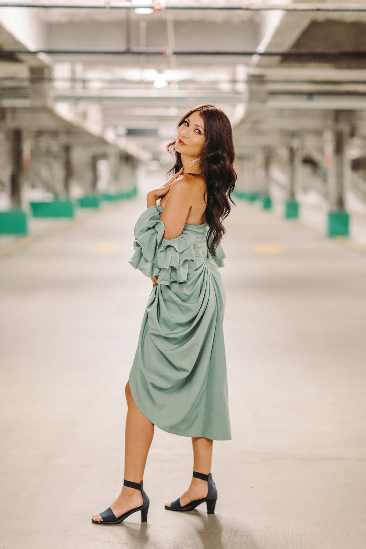 Utah Family Photographer captures woman looking over shoulder wearing dress during brand shoot