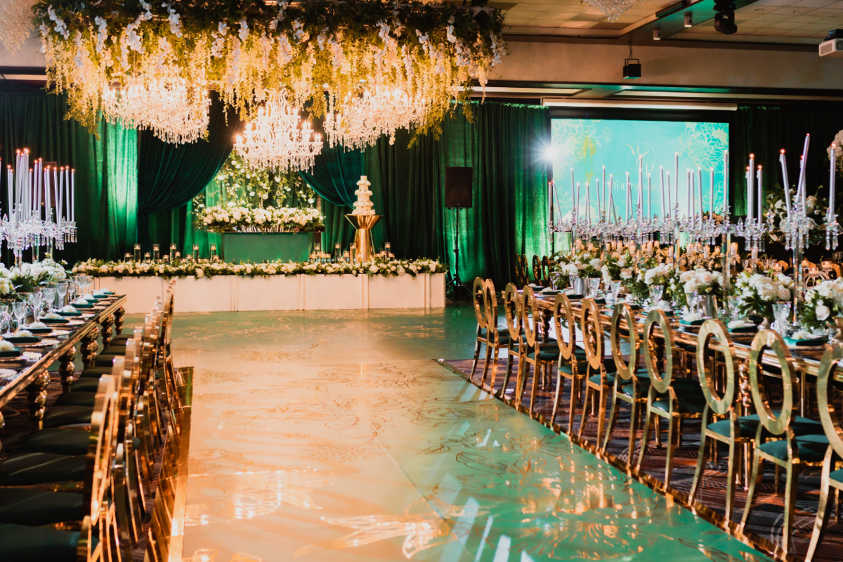 emerald-green-gold-luxury-reception-greenery-chandeliers-candelabras-vinyl-floor