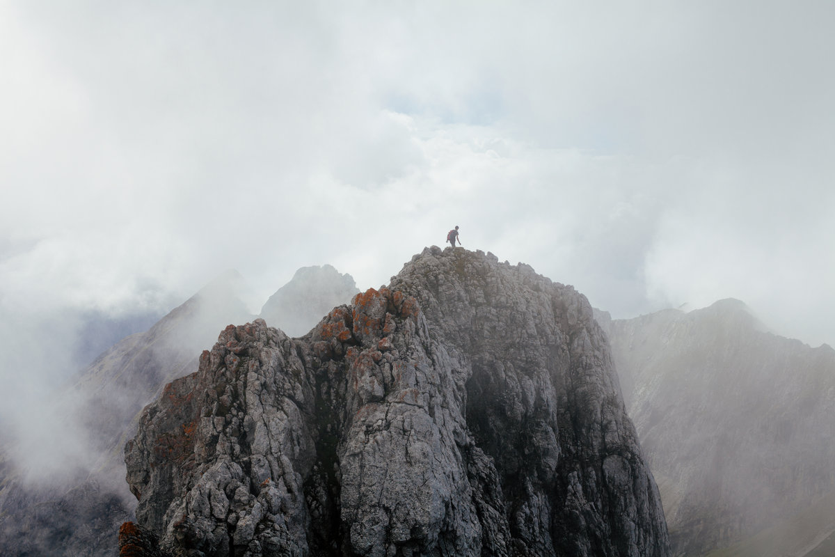 man_under_clouds