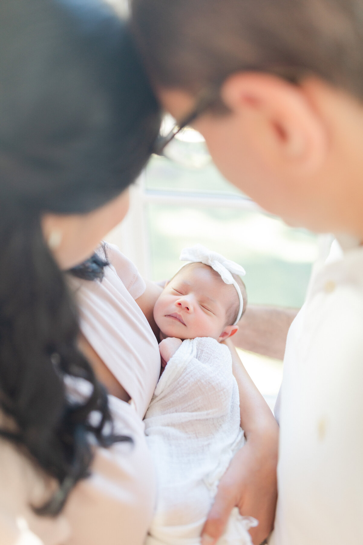 Parents holding newborn baby - Roswell Newborn Photographer