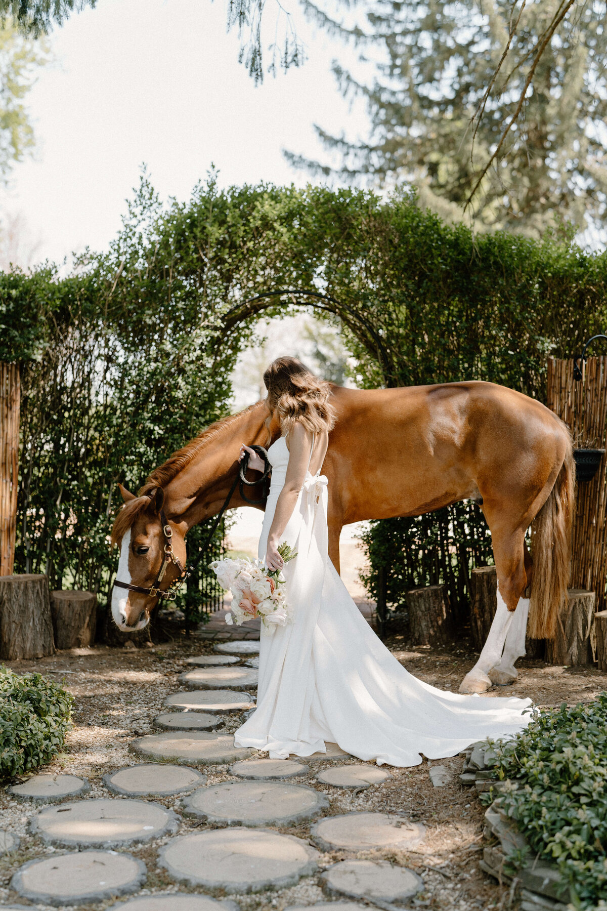 bride standing by horse at at white chimneys estate wedding, Lancaster, PA