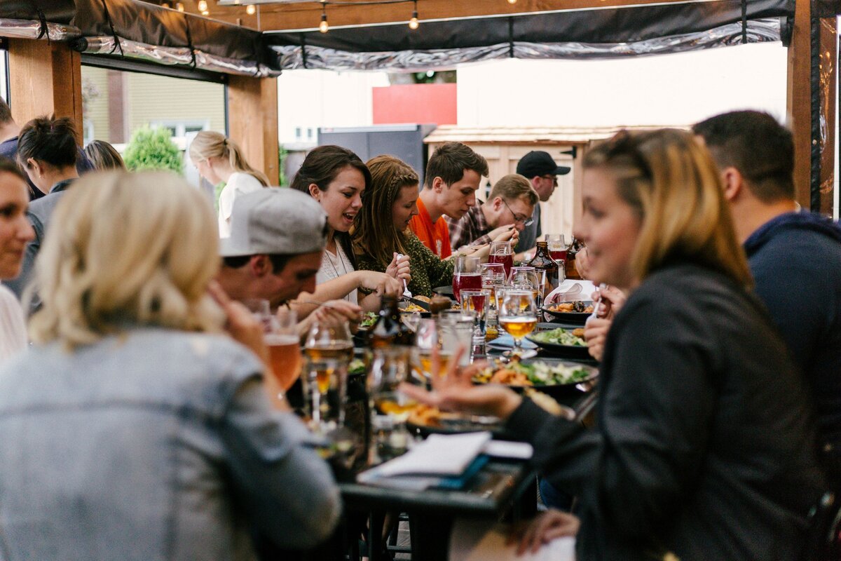 Young people eating around a table
