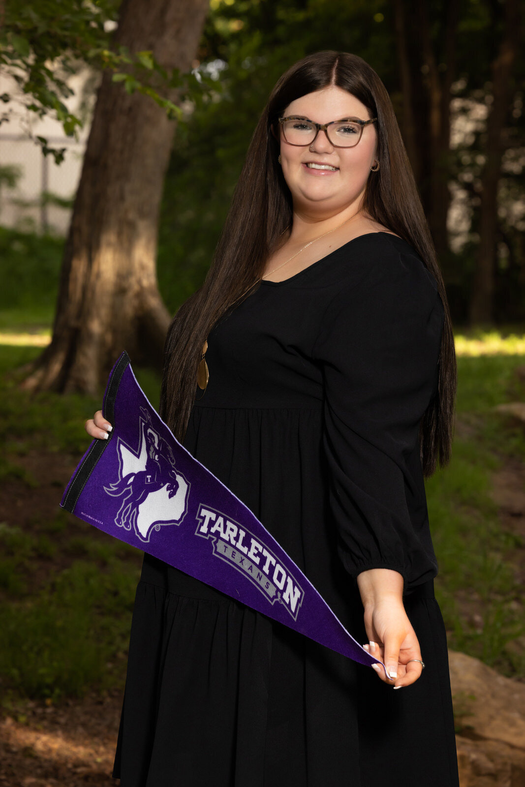 senior-girl-holding-tarleton-banner