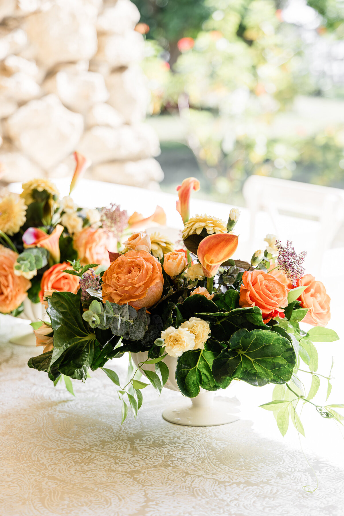 orange rose and calla lily centerpiece